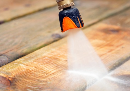 Close Up of a Pressure Washing Tool Being Used to for Professional Deck Cleaning